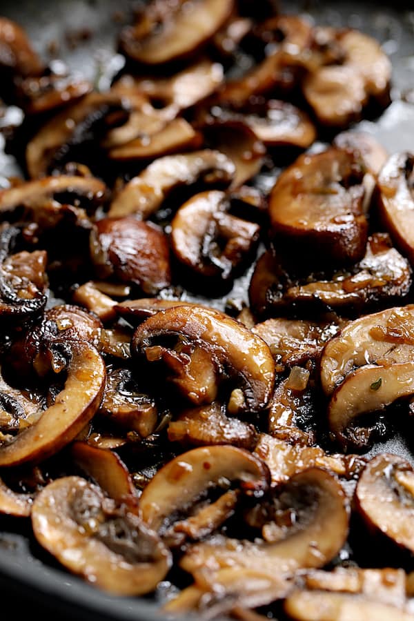 Close-up shot of browned mushrooms in skillet