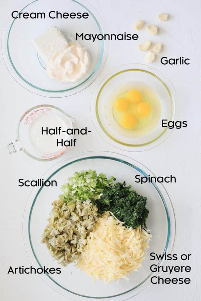 Photo of ingredients for Spinach Artichoke Squares in glass bowls.