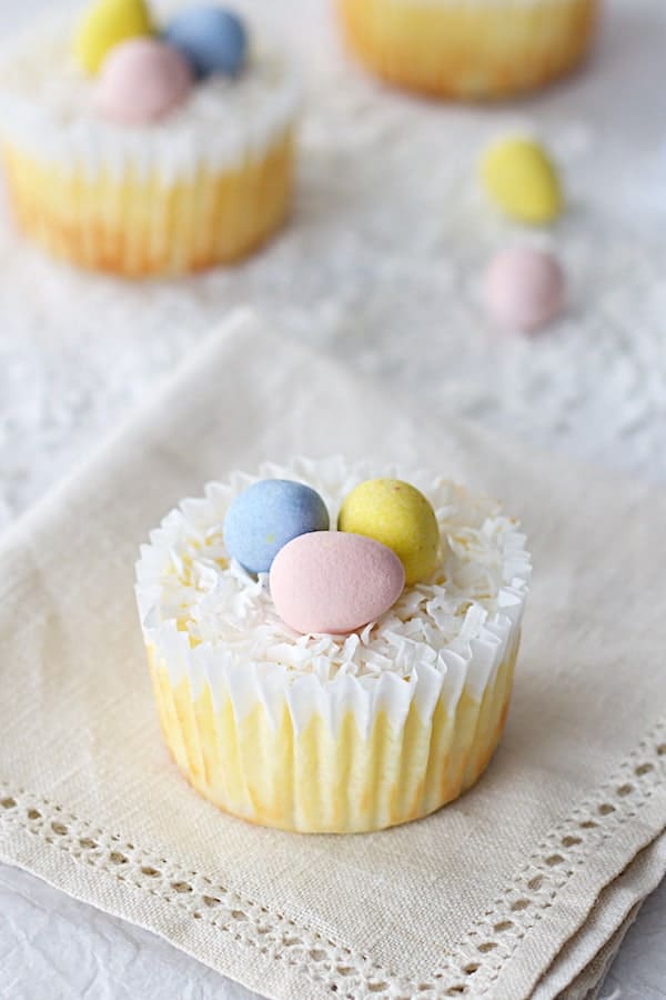 Photo of Lighter Mini Cheesecakes on folded embroidered napkin.