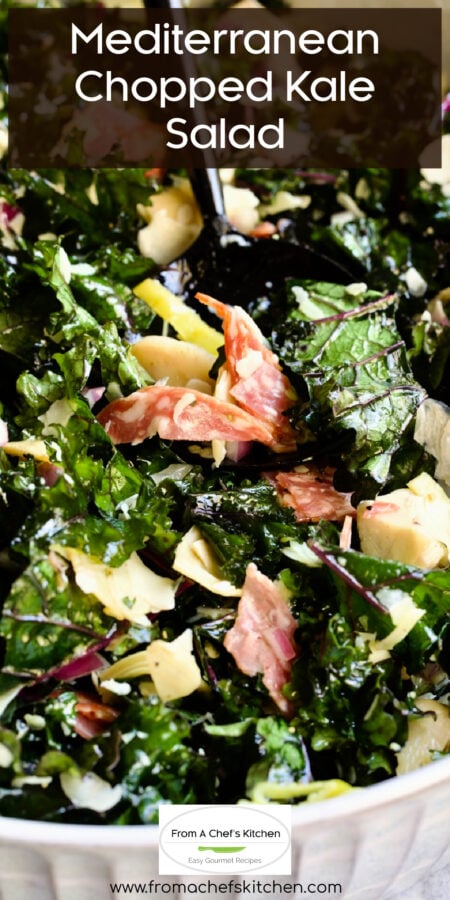 Pinterest graphic for Mediterranean Chopped Kale Salad showing it in a white bowl with black utensils.