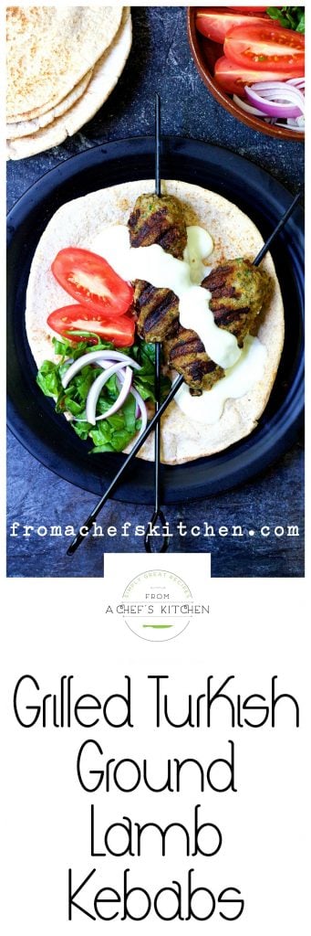 Pinterest graphic for Grilled Turkish Ground Lamb Kebabs showing it on black plate over pita bread.