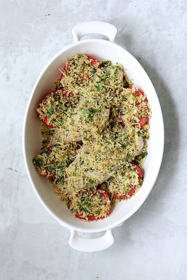 Photo of dish with breadcrumbs sprinkled over the top before being baked.