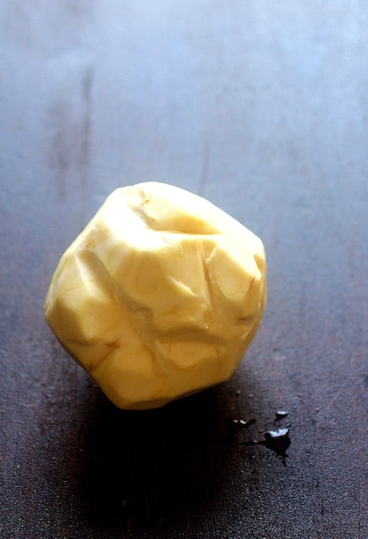 Photo of a bulb of celery root that has been peeled.