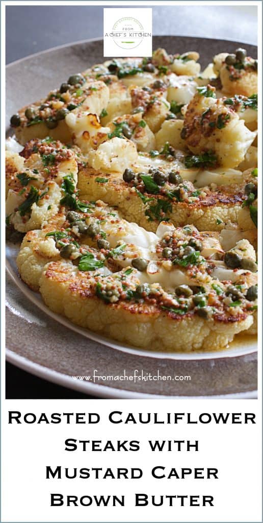 Pinterest graphic for Roasted Cauliflower Steaks with Mustard Caper Brown Butter showing them on a gray-rimmed platter.