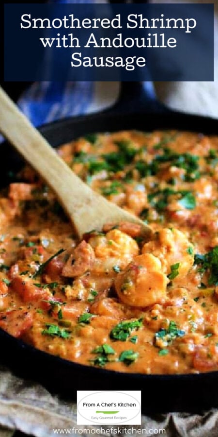 Pinterest graphic for Smothered Shrimp with Andouille Sausage showing it in a cast iron skillet being stirred with wooden spoon,