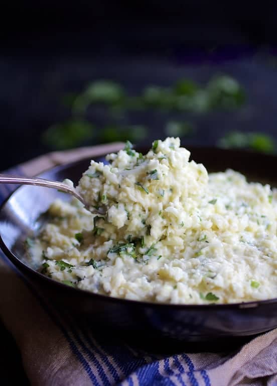 Photo of Cauliflower Grits with Gouda Cheese being served with spoon.