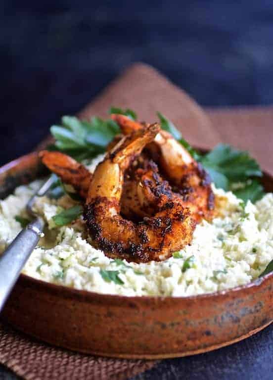 Cauliflower Grits with Gouda Cheese and Blackened Shrimp in earthenware bowl.