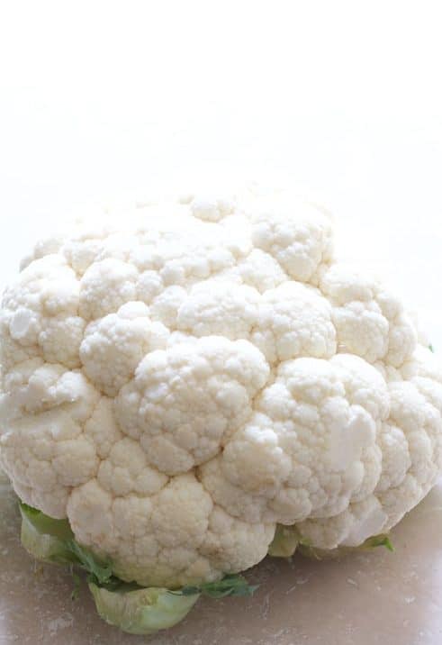 Photo of a head of white cauliflower.