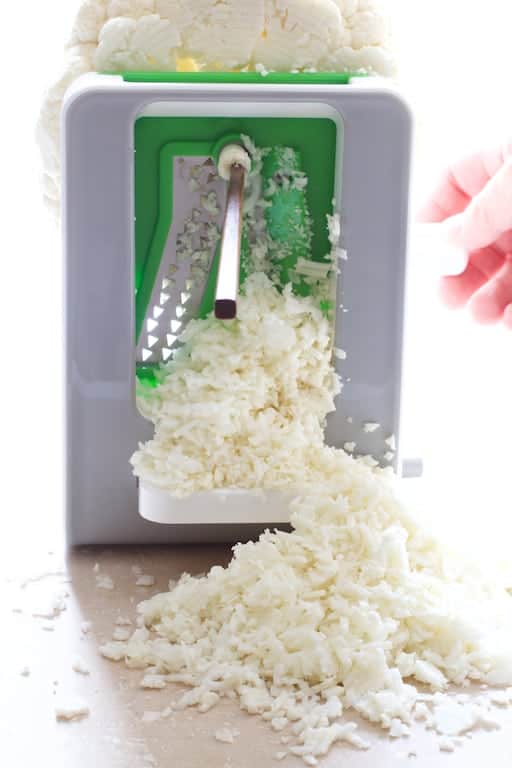 Photo of cauliflower in tiny bits as its coming out of the spiralizer.