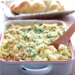 Baked Orecchiette with Cauliflower, Bacon and Taleggio in white baking dish.
