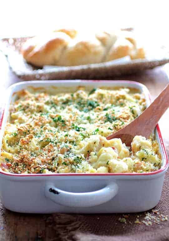 Baked Orecchiette with Cauliflower, Bacon and Taleggio in white baking dish.