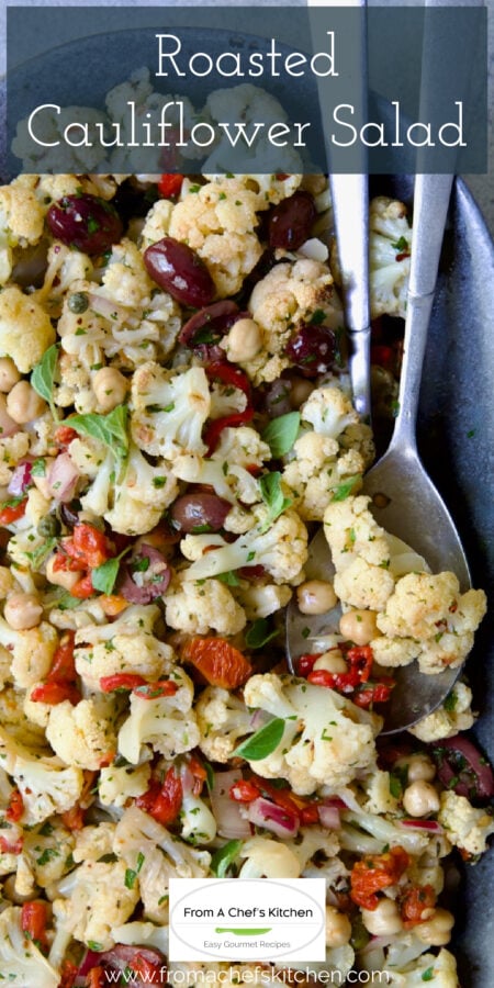 Pinterest graphic for Roasted Cauliflower Salad showing it on a gray speckled platter with serving utensils.