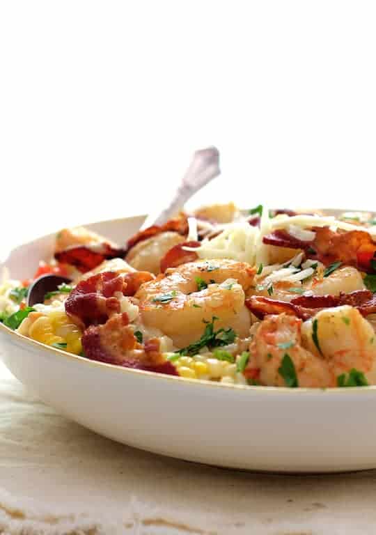 Photo of Shrimp and Corn Risotto with Bacon in white bowl.