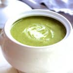 Cream of Green Vegetable Soup in white bowl.