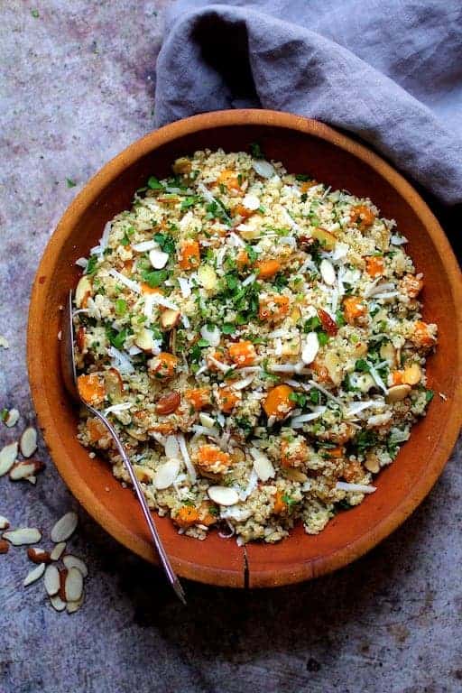 Lemony Quinoa with Roasted Butternut Squash Almonds and Parmesan Cheese in wood bowl.
