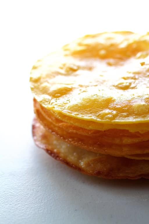 Photo of a stack of fried corn tortillas.