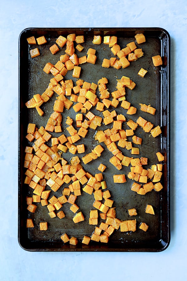 Photo of roasted butternut squash on baking sheet.