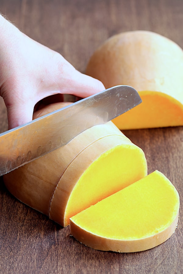 Photo showing how to cut the bottom portion of a butternut squash.