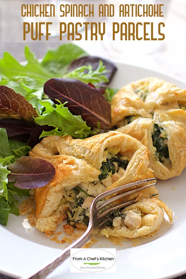 Pinterest graphic for Chicken, Spinach and Artichoke Puff Pastry Parcels on white plate showing a fork cutting into one.