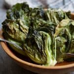 Duck Fat Roasted Cabbage Sprouts in wooden bowl.
