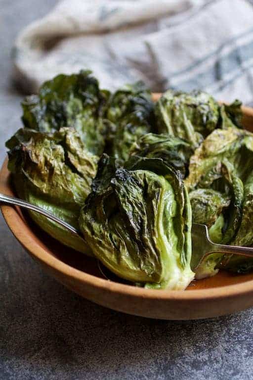Photo of Duck Fat Roasted Cabbage Sprouts in wooden bowl.