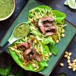 Thai Beef Lettuce Wraps with Mint Dressing and Vegetable Slaw on square green plate.