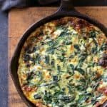 Spinach Leek and Feta Cheese Frittata in cast iron skillet.