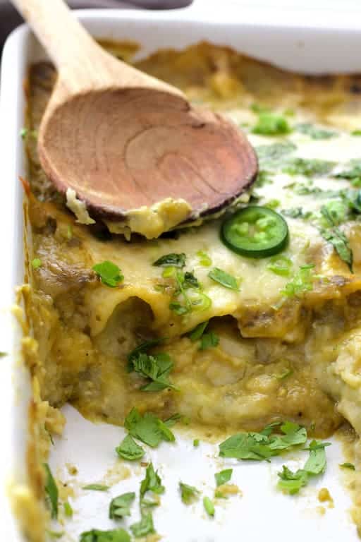Close-up photo showing interior of enchiladas after removing some from the pan.