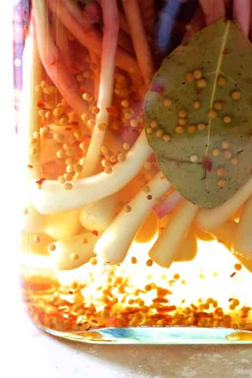 Ramps in pickling brine in glass jar.