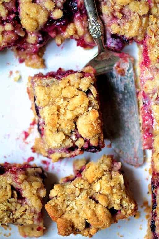 Rectangular pieces of Blueberry Crumble Bars with ornate server.
