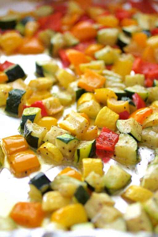 Photo of vegetables on baking sheet after being roasted.