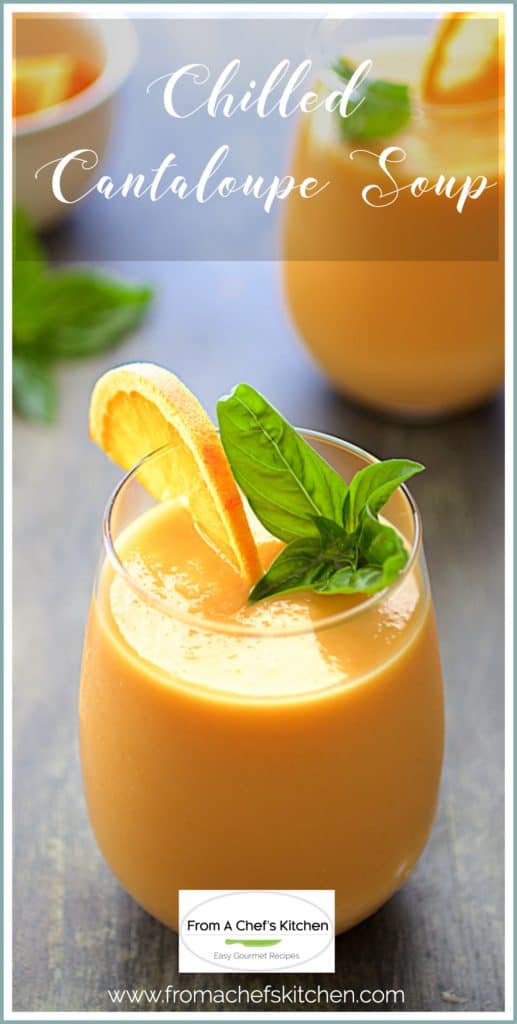 Pinterest graphic for Chilled Cantaloupe Soup showing it in a clear glass garnished with orange wedge and basil sprig.