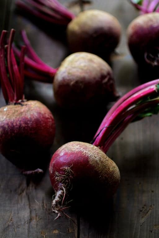 Photo of fresh, raw, uncooked red beets.