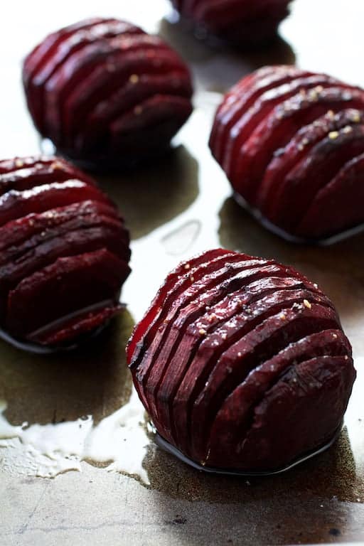 Photo of roasted red hasselback beets.