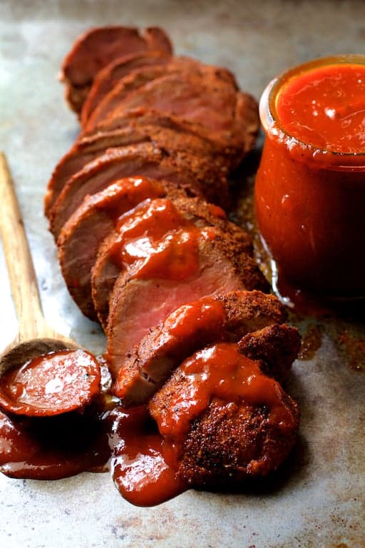 Photo of Spice Rubbed Pork Tenderloin with Peach Chipotle Barbecue Sauce.