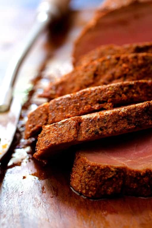 Close-up photo of cooked, sliced pork tenderloin.