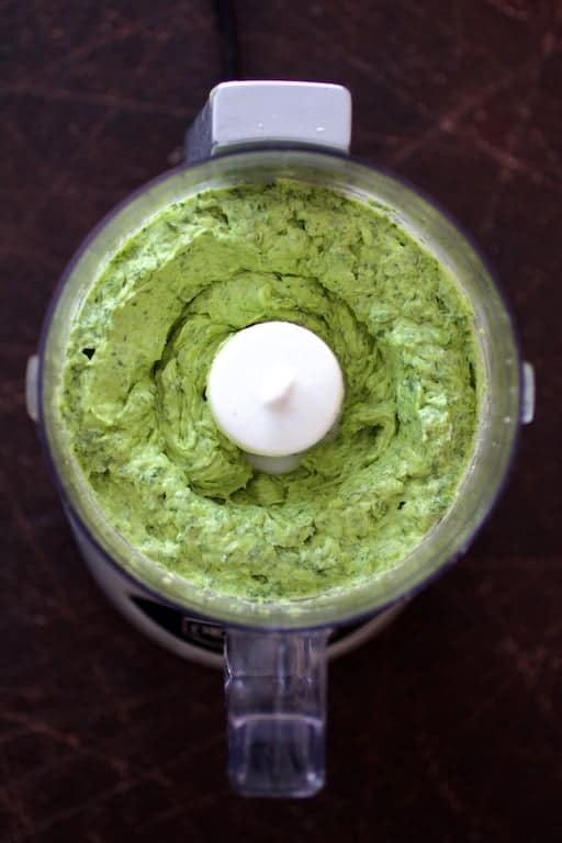 Photo of avocado butter in mini food processor after blending.