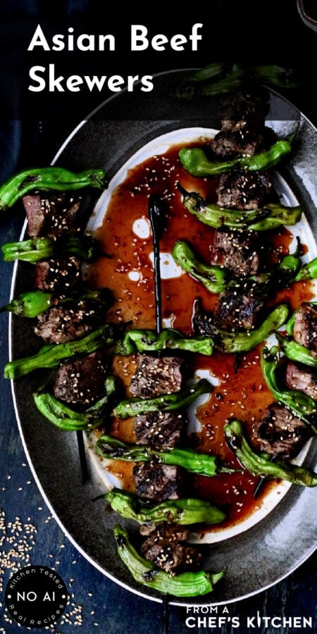 Pinterest graphic for Asian Beef Skewers showing them on a gray-rimmed platter.