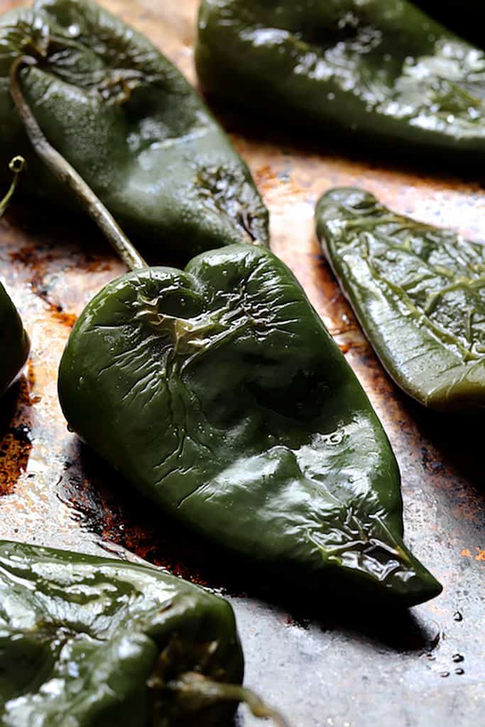 Photo of roasted Poblano peppers on baking sheet after being roasted.