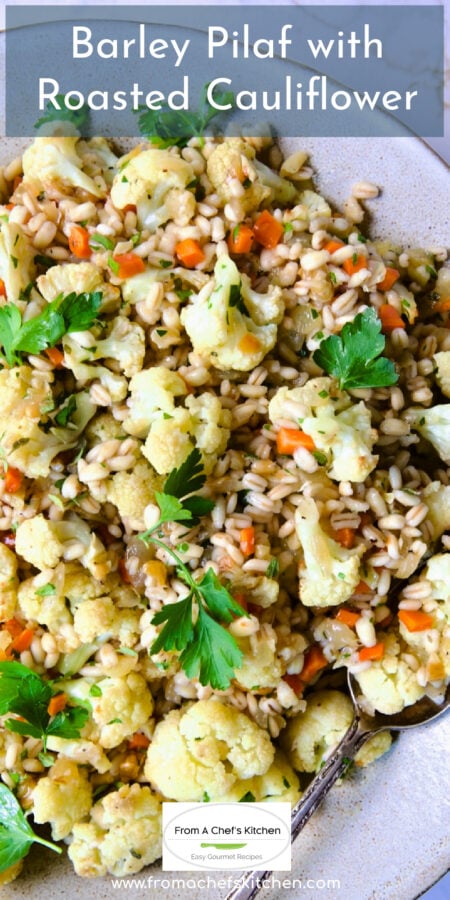 Pinterest graphic for Barley Pilaf with Roasted Cauliflower showing it in a white serving dish with serving spoon.
