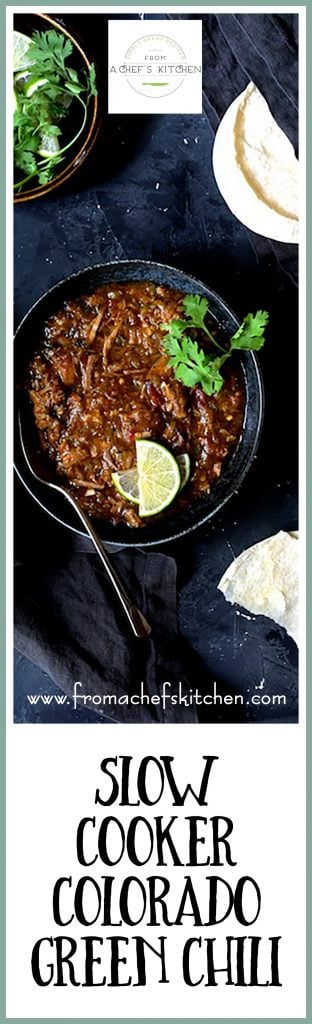 Pinterest graphic for Slow Cooker Colorado Green Chili showing it in a black bowl with spoon garnished with lime wedges and cilantro sprigs.