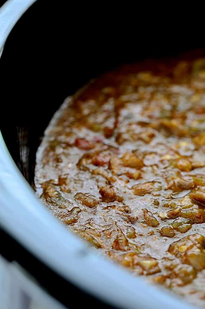 Close-up photo of chili looking into slow cooker.