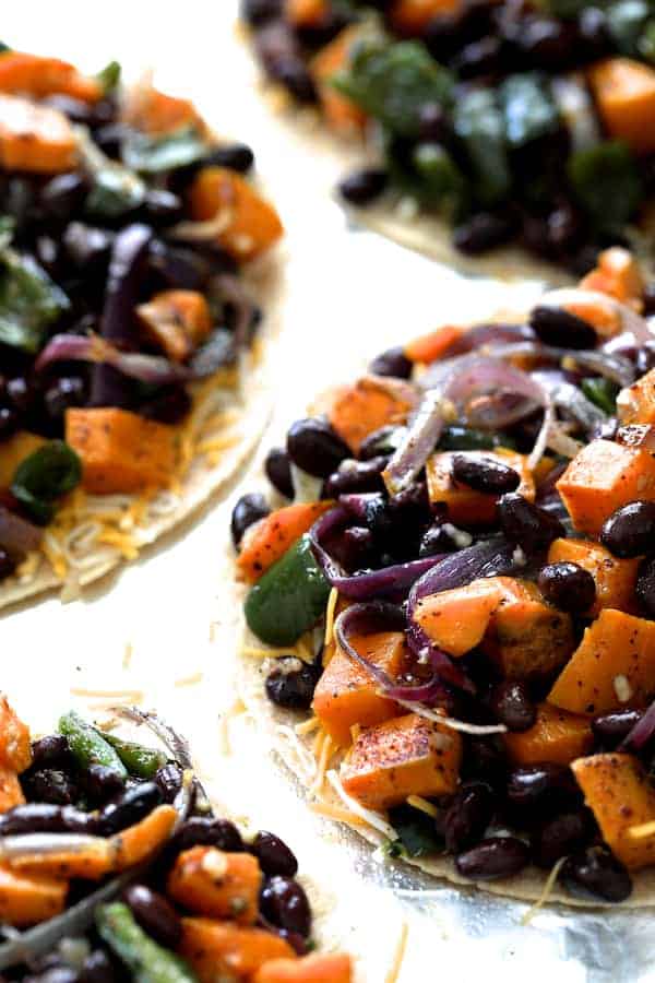 Photo of sweet potato filling on tortillas without top tortilla.