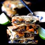 Stack of four Sheet Pan Sweet Potat, Poblano and Black Bean Quesadillas wedges.