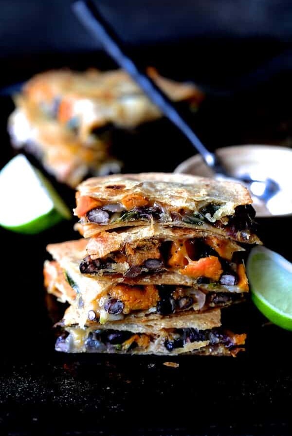 Stack of four Sheet Pan Sweet Potat, Poblano and Black Bean Quesadillas wedges.