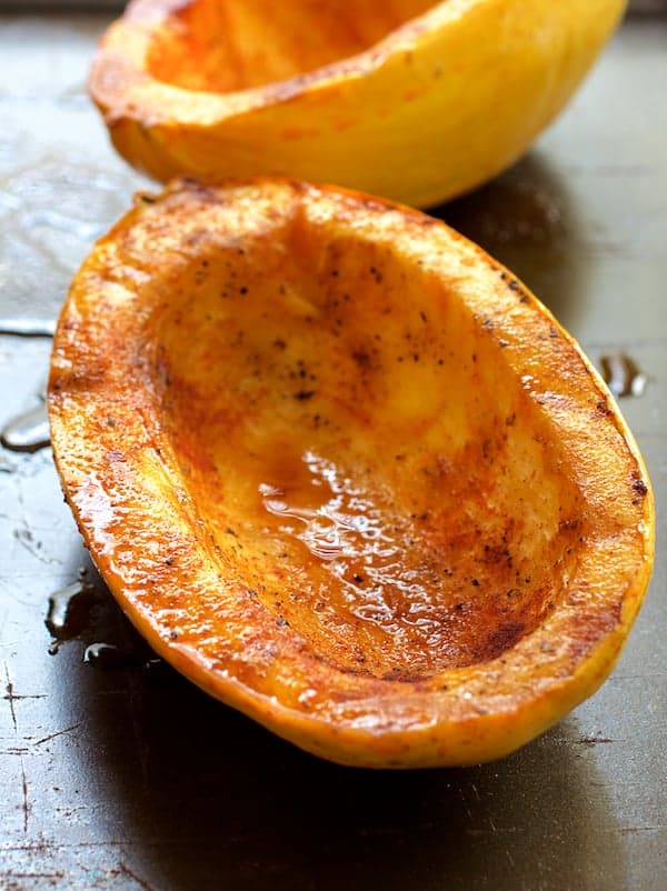 Photo of two roasted spaghetti squash halves.
