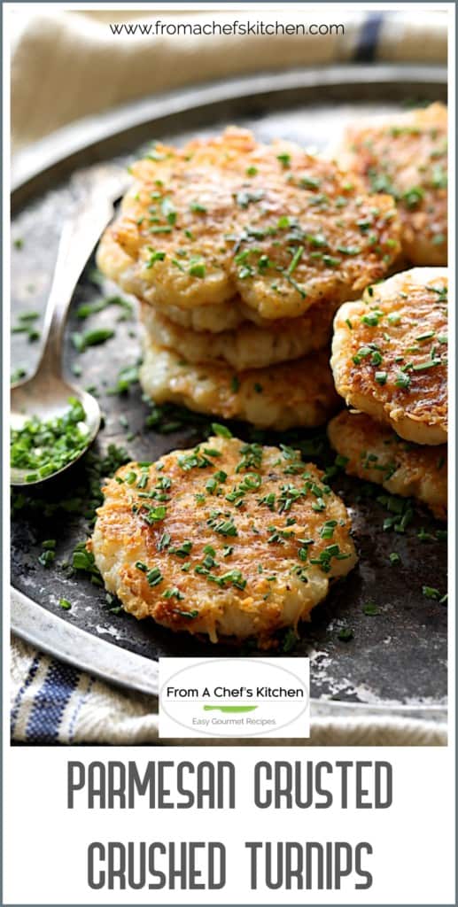 Pinterest graphic for Parmesan Crusted Crushed Turnips showing them on a metal platter garnished with chopped chives.