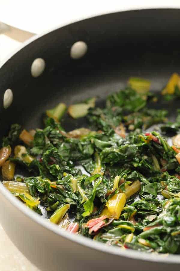 Photo of cooked Swiss chard in nonstick skillet.