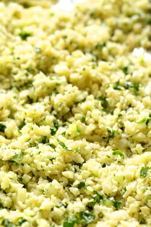 Close-up photo of Cilantro Lime Cauliflower Rice on sheet pan after roasting.