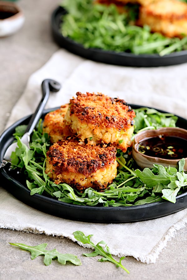 Close-up photo of stack of three Tuna Kimchi Cakes with Soy Ginger Dipping Sauce.